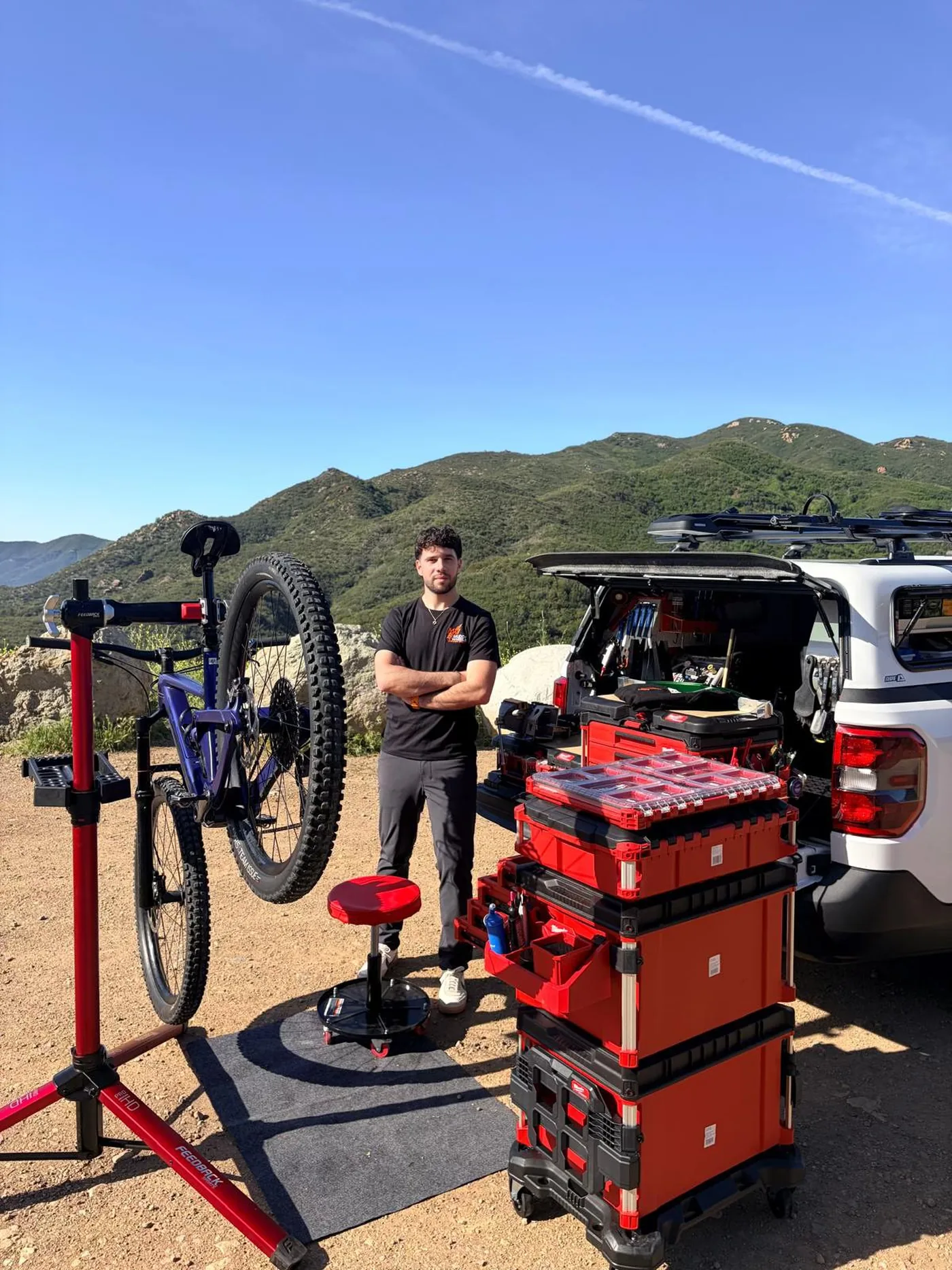 Shlomi of Muddy Wheels with his mobile bike workshop and repair stand in the Santa Monica Mountains, Los Angeles