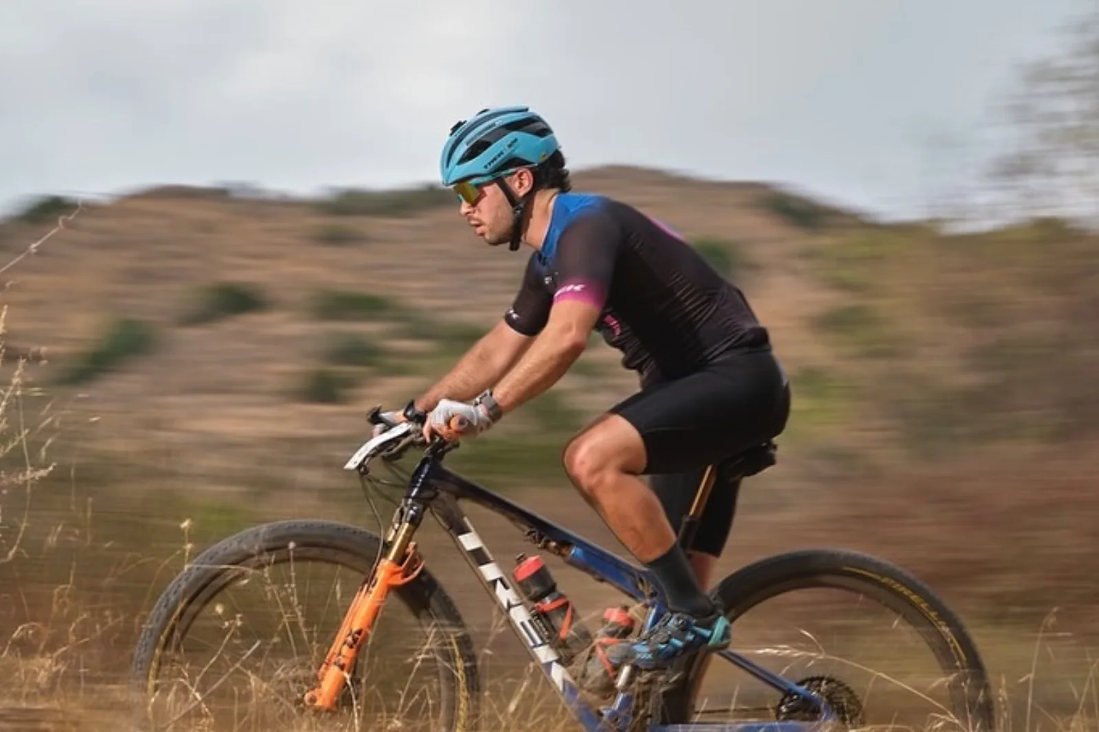 Shlomi racing his Trek mountain bike across the golden Los Angeles foothills