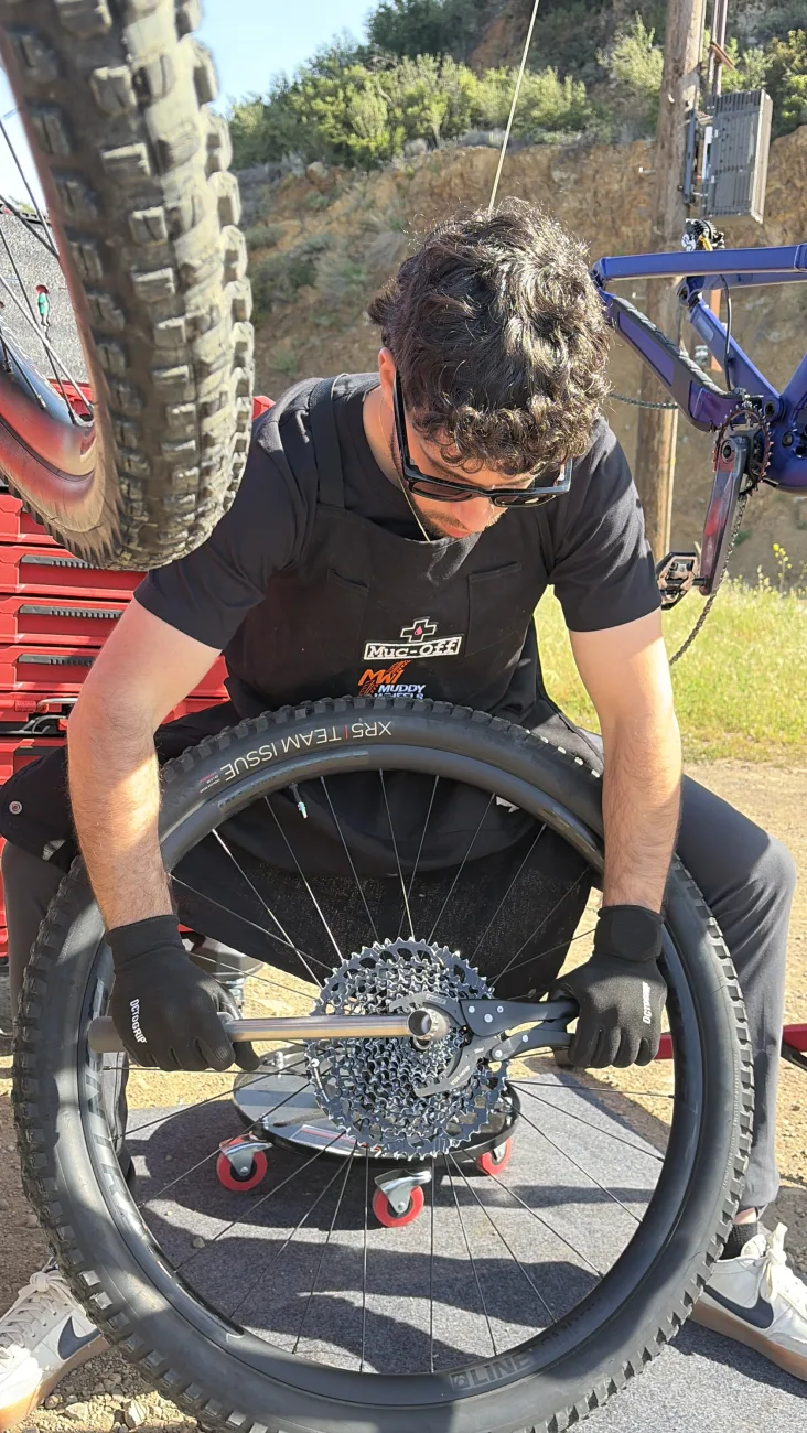 Truing a wheel and servicing the drivetrain during a Gold service